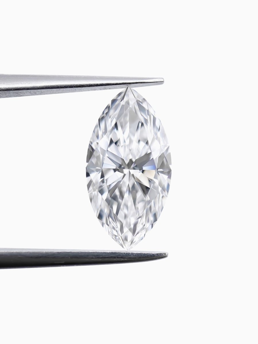 Marquise-shaped diamond on a white background held by tweezers