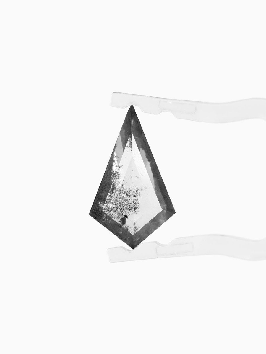 face view of loose lab-grown kite salt pepper diamond gemstone, held by tweezers