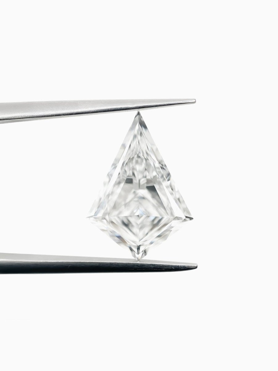 brilliant lab grown sustainable kite diamond on a white background held between tweezers
