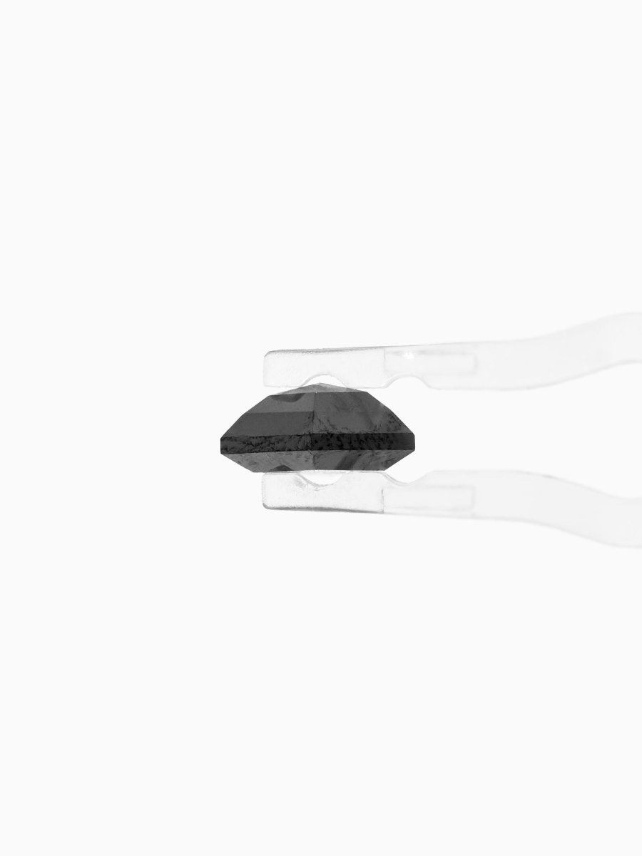 side view of loose lab-grown kite salt pepper diamond gemstone, held by tweezers