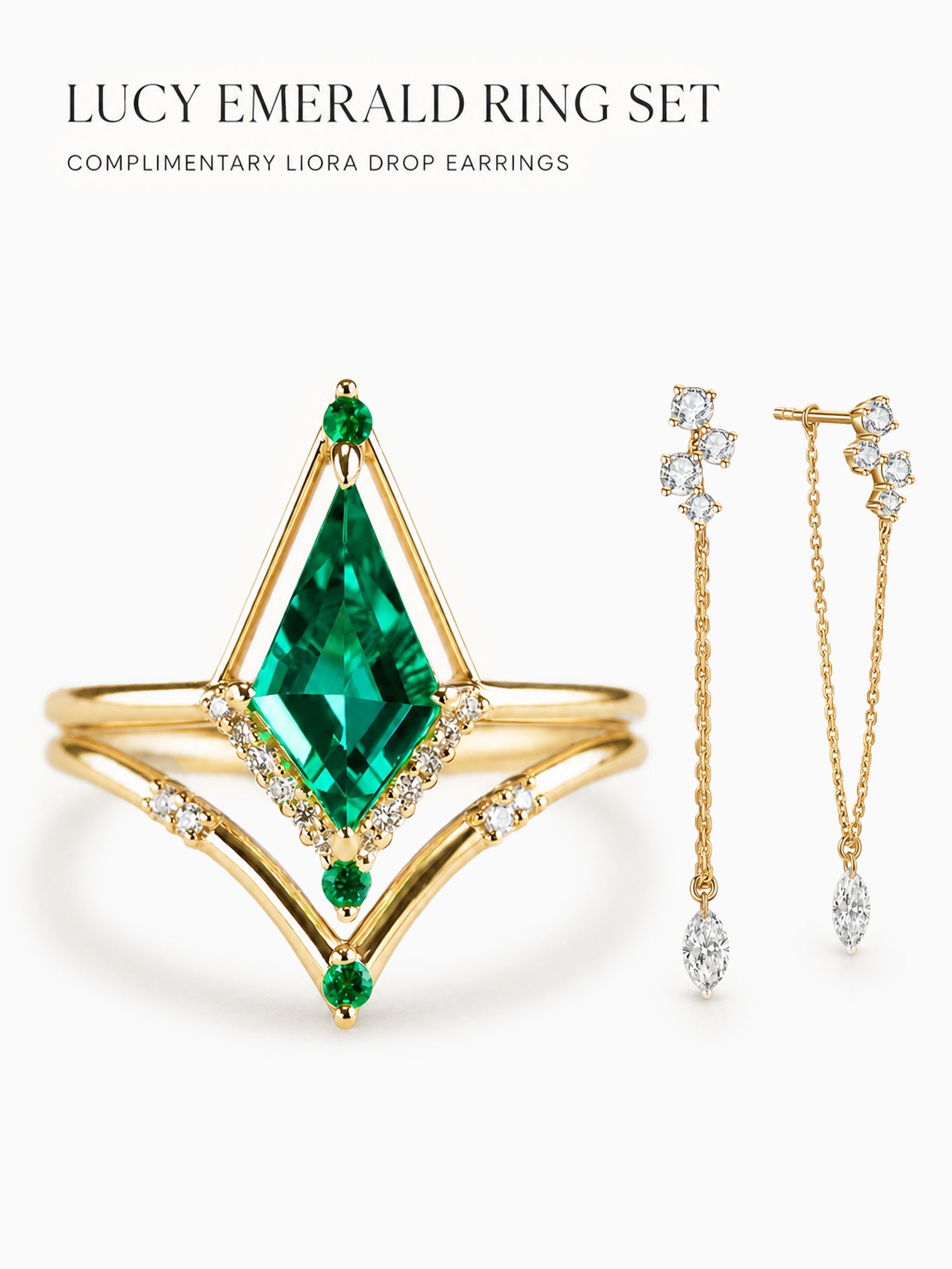 Gold ring set featuring a large emerald-cut green gemstone and smaller green accent stones, shown with matching gold drop earrings with clear stones on a white background. Text at the top reads 'LUCY EMERALD RING SET' and 'COMPLIMENTARY LIORA DROP EARRINGS'.