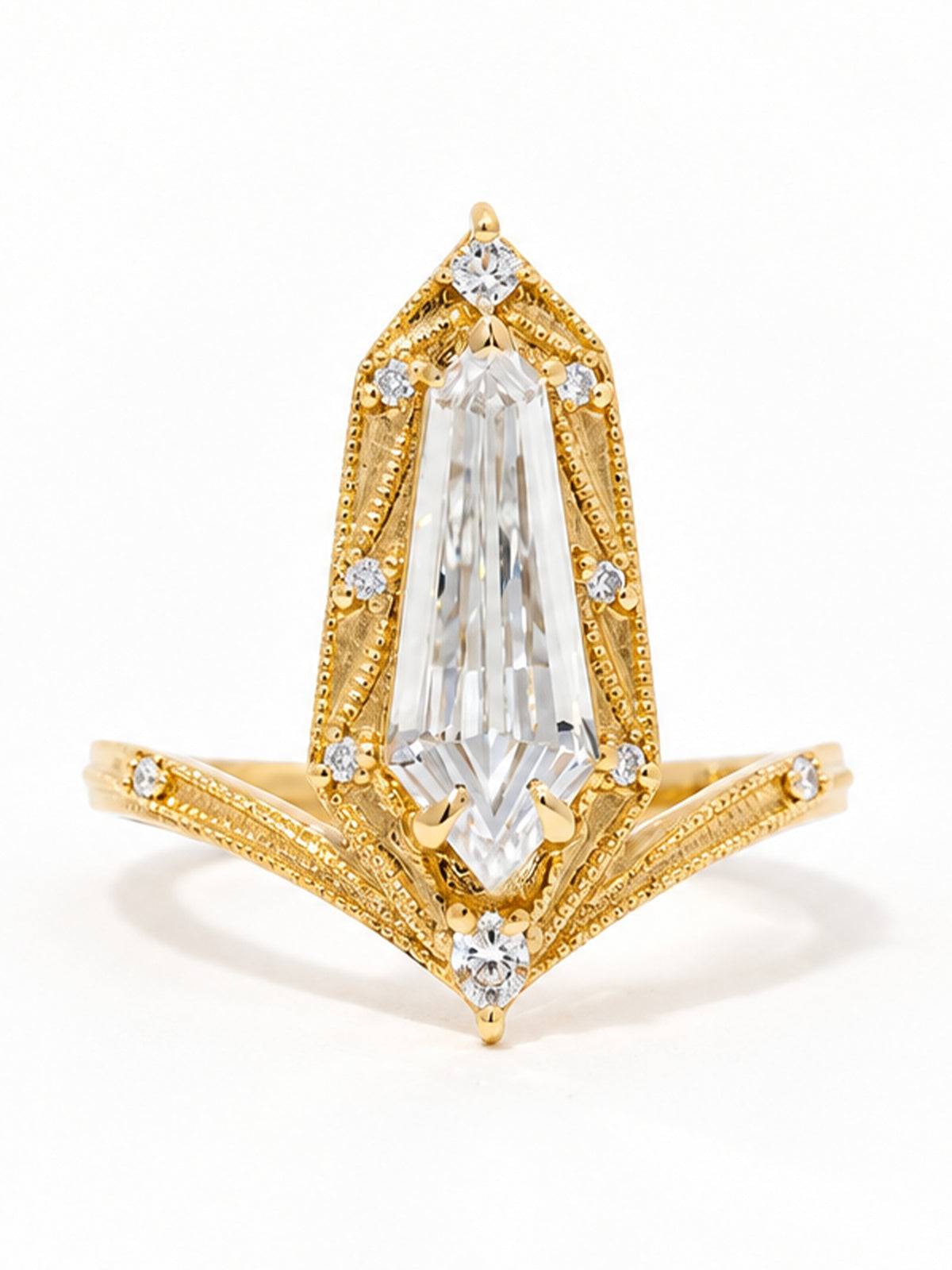 A yellow gold Art Deco style ring featuring a large shield clear center stone and smaller accent diamonds, set against a plain white background.