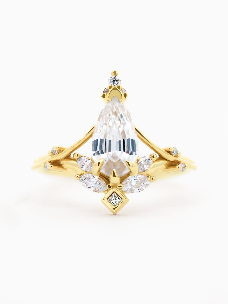 Face of Art Nouveau engagement ring with marquise diamond, split shank, milgrain accents, and chevron band