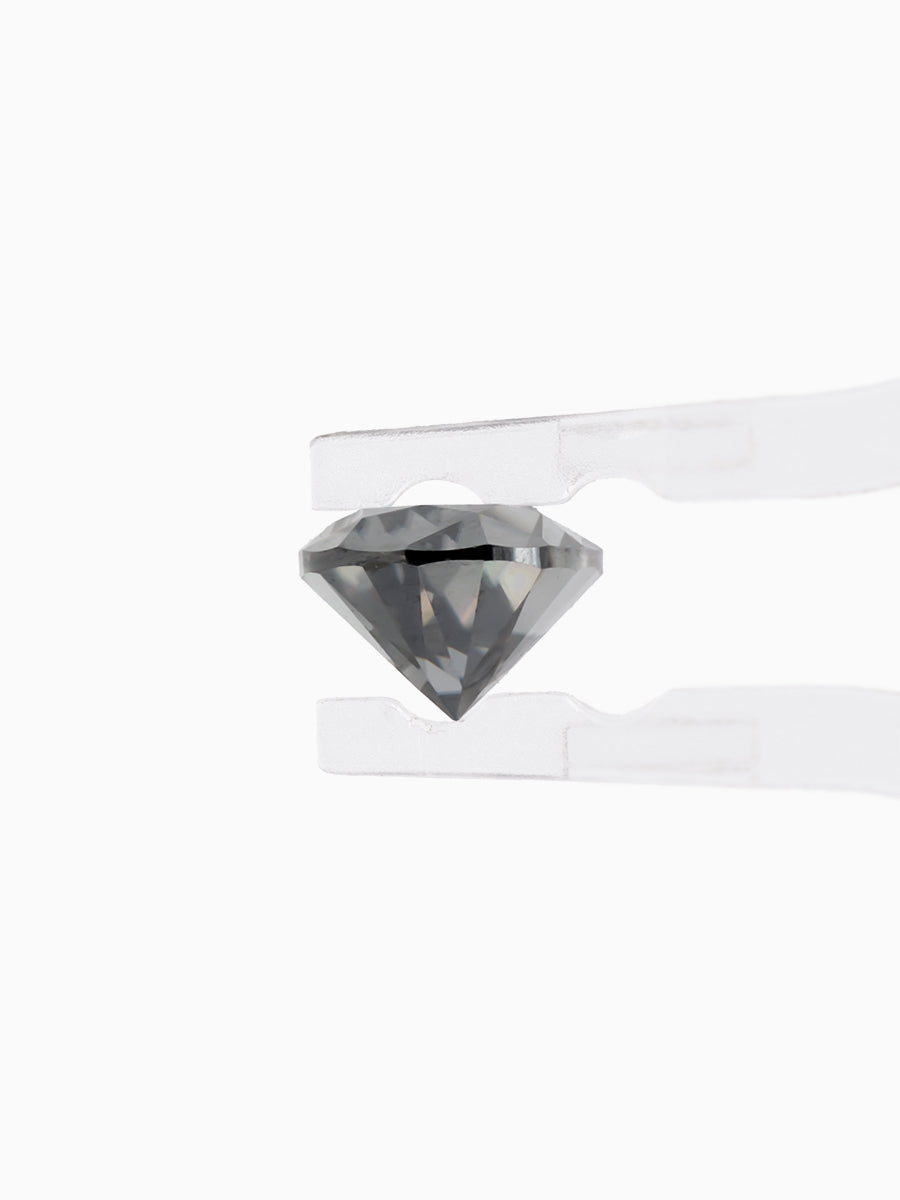 Black Pear Shaped Moissanite on White Background Held by tweezers, Side view