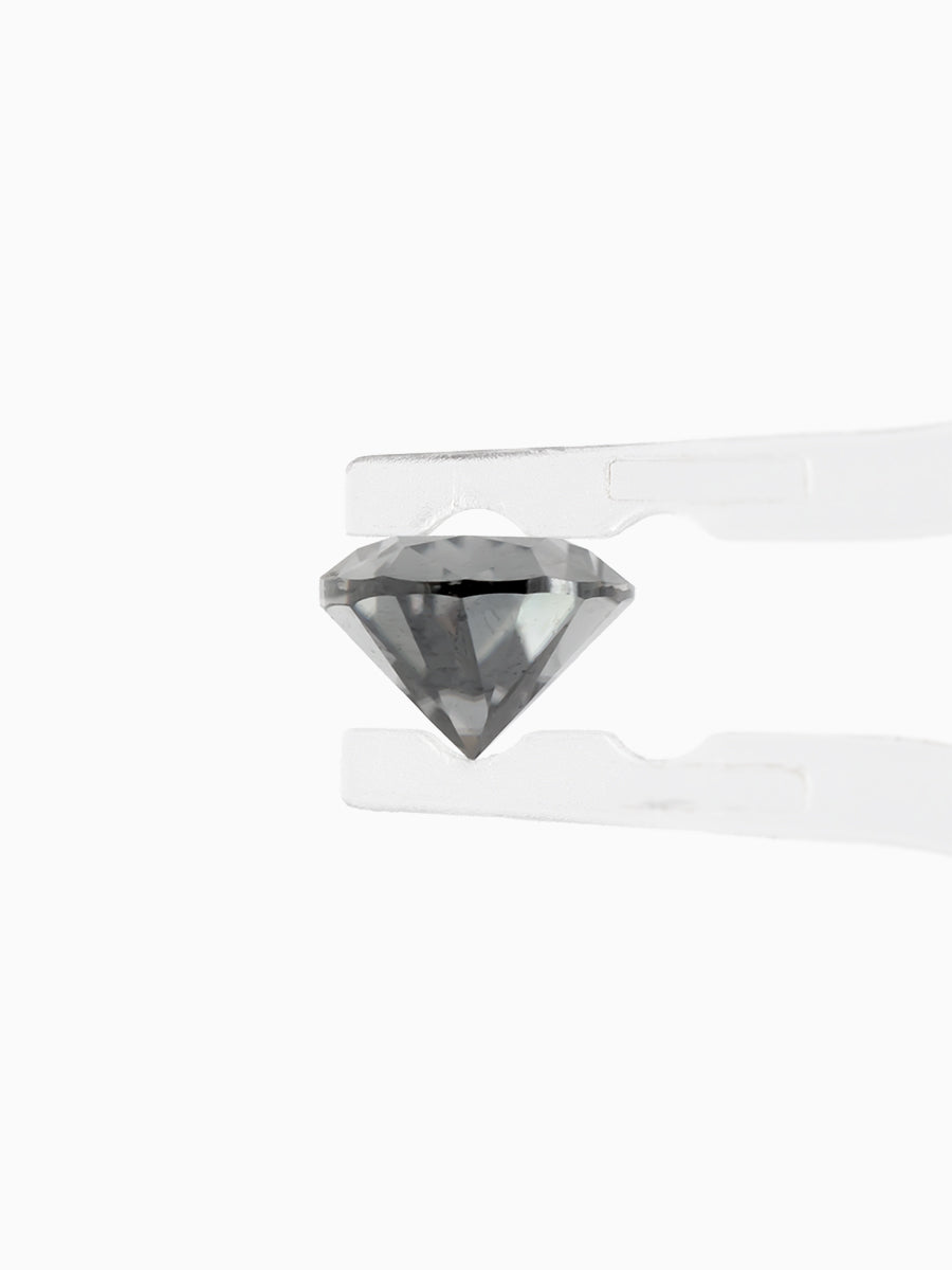 Black Pear Shaped Moissanite on White Background Held by tweezers, Side view