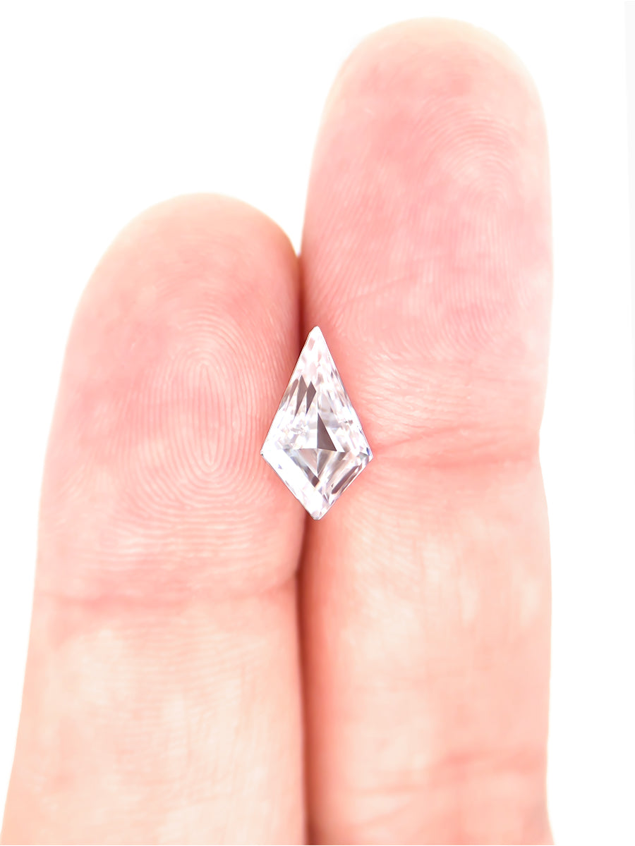 clear moissanite kite on finger to show scale