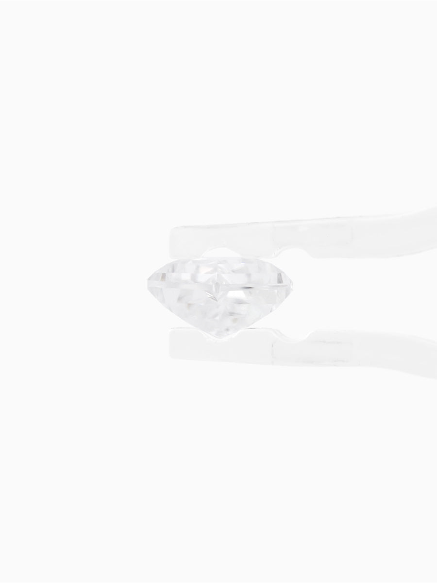 profile view of clear moissanite kite held by tweezers to show thickness