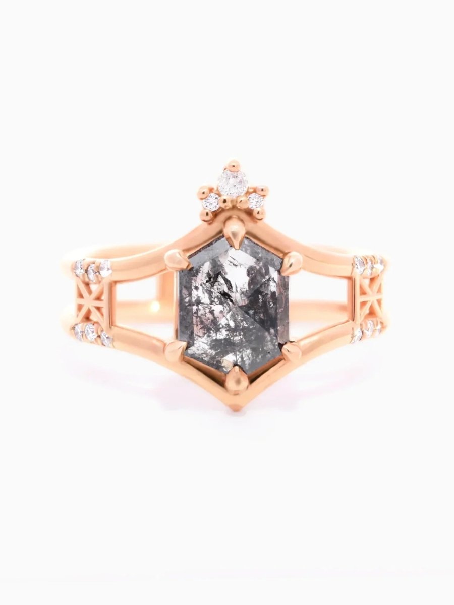 Face of contemporary double-banded chevron engagement ring with hexagon center, round melee trefoil, and Art Deco lattice