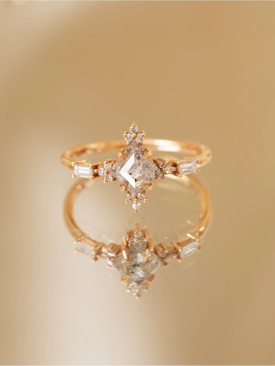 Gold ring with diamond accents on a gold background