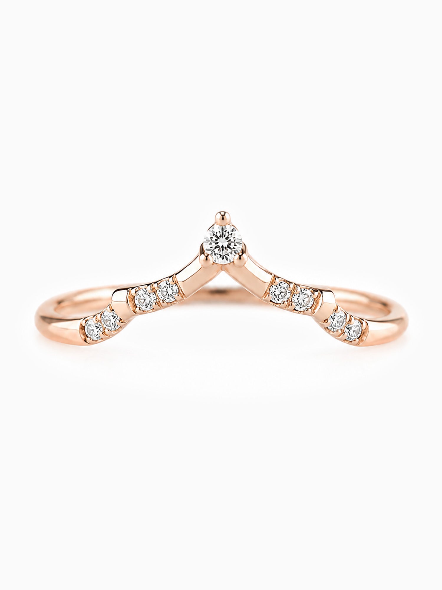 Rose gold ring with diamond accents on a white background Unique wedding band