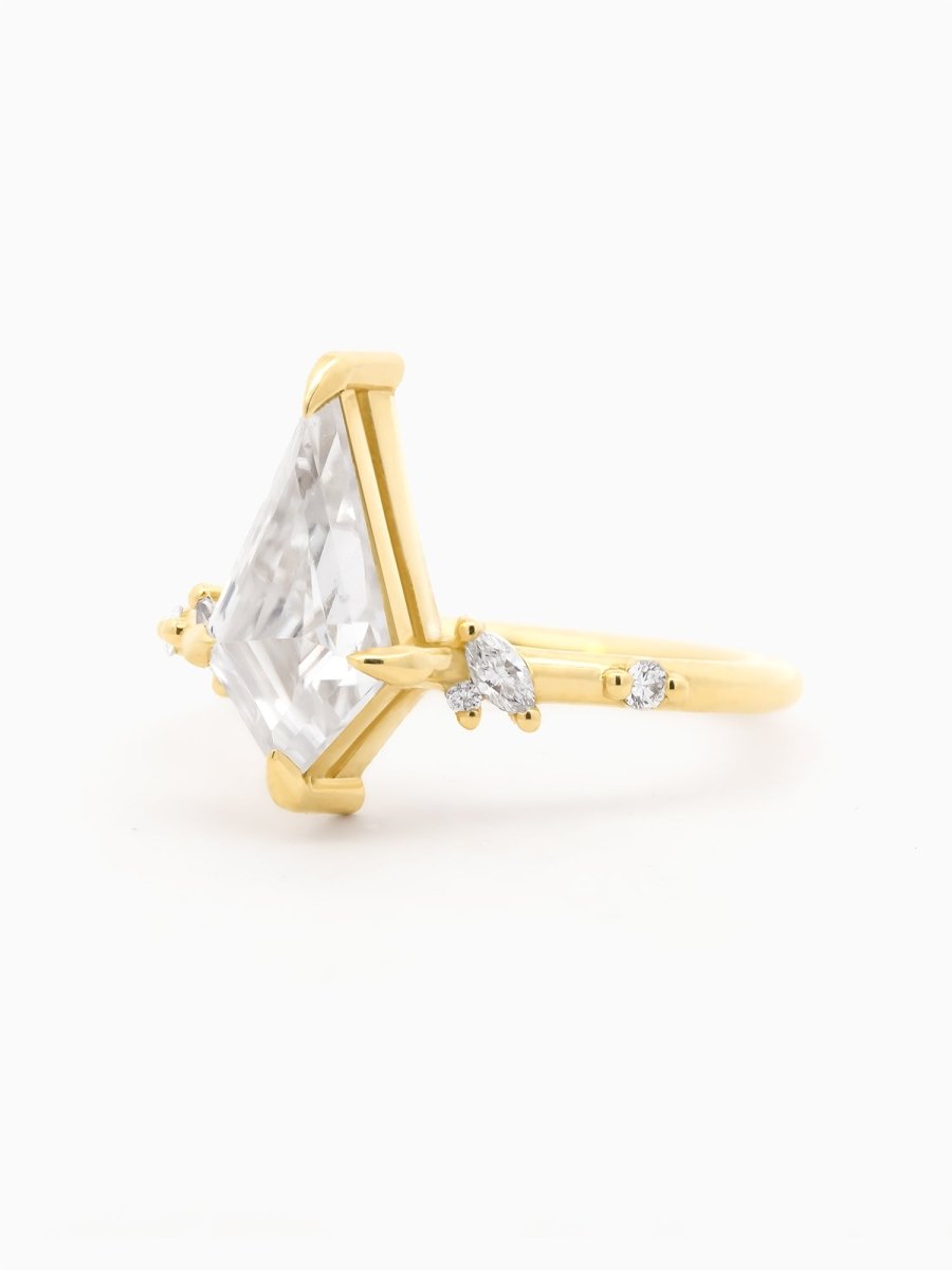 Three-quarter view of Mikaela Ring showing floating Moissanite and gentle diamond cluster accents