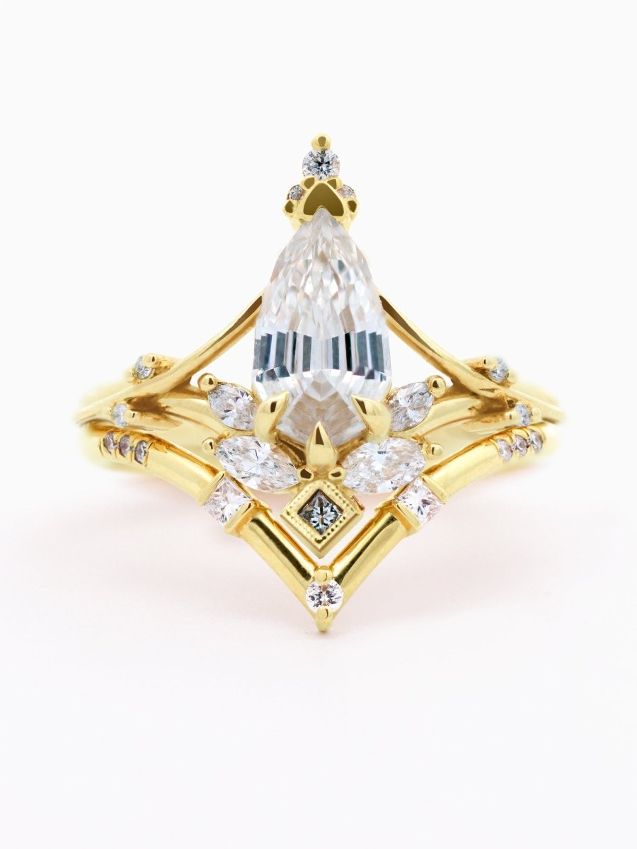 face of side of Art Nouveau engagement ring with marquise diamond, split shank, milgrain accents, and chevron contour band