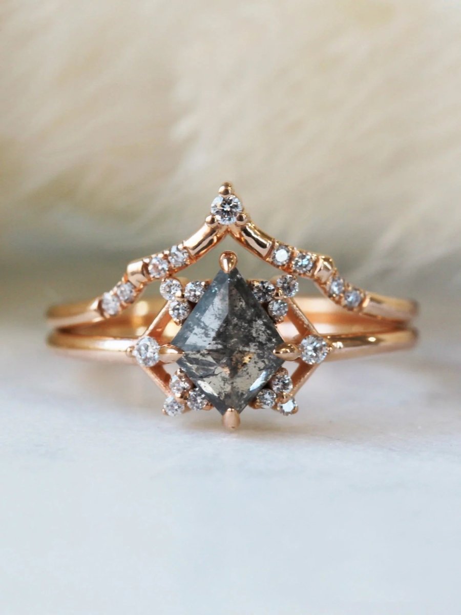 Delicate art deco style kite salt and pepper diamond engagement ring in 14k rose gold with smaller round diamonds.