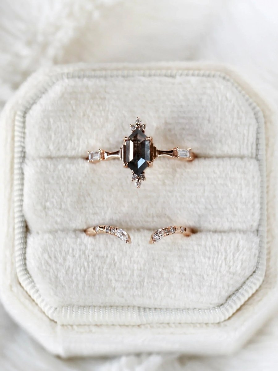 Minimalistic and art deco styled hexagon salt and pepper diamond engagement ring in 14k rose gold with round and baguette diamonds.