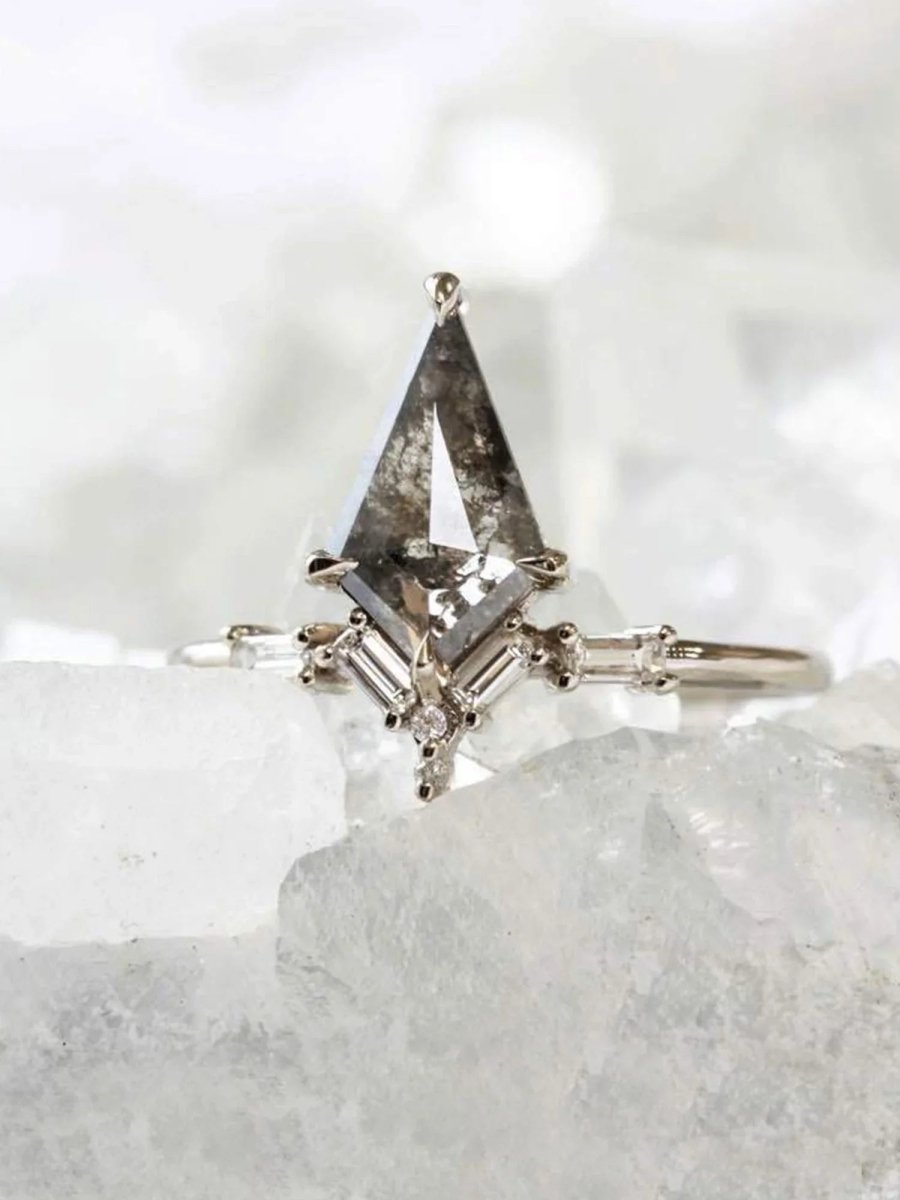 Kite salt and pepper diamond engagement ring in 14k rose gold with baguette and round diamonds inspired by the art deco style and minimalism.