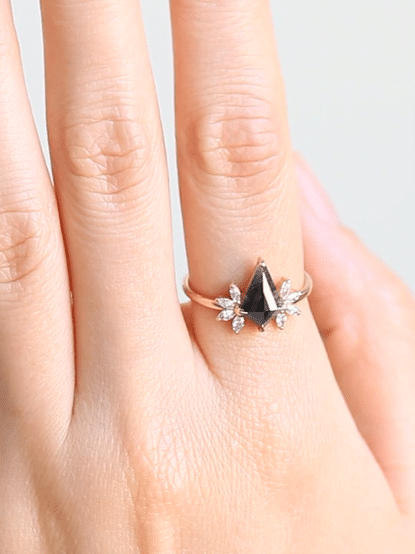 Kite salt and pepper diamond engagement ring in 14k rose gold with four marquise arrangements on each side inspired by the art deco style and minimalism.