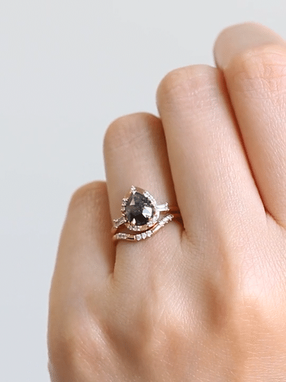 Pear-shaped salt and pepper diamond engagement ring in 14k rose gold inspired by the art deco style and minimalism.