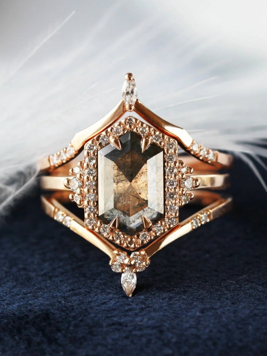 Unique art deco styled hexagon salt and pepper diamond engagement ring in 14k rose gold with round diamonds with matching bands.