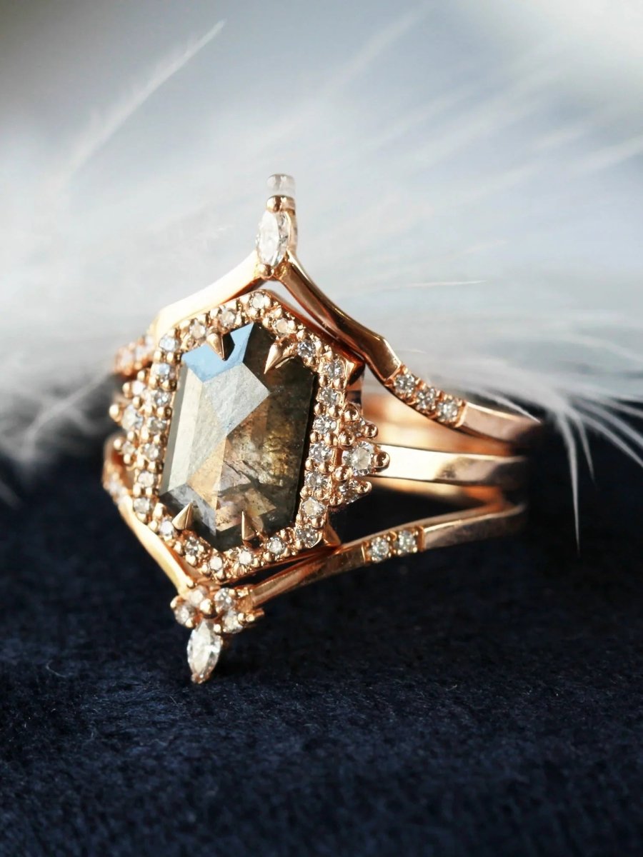 Unique art deco styled hexagon salt and pepper diamond engagement ring in 14k rose gold with round diamonds with matching bands.