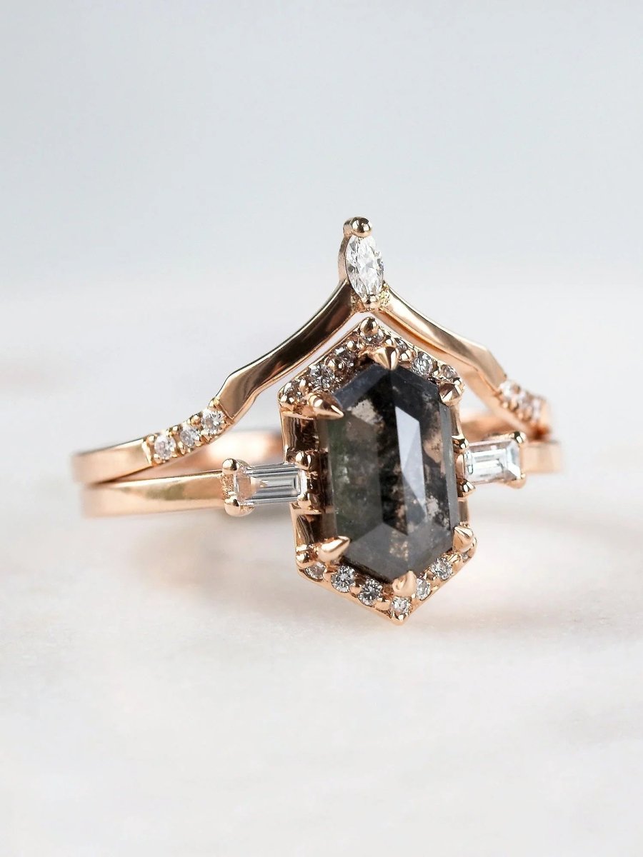 Unique art deco styled hexagon salt and pepper diamond engagement ring in 14k rose gold with baguette and round diamonds with matching band.