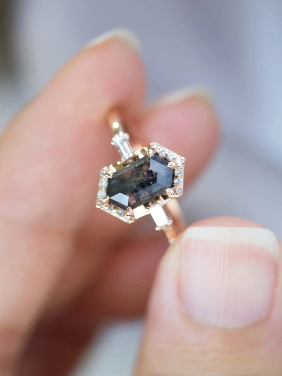Unique art deco styled hexagon salt and pepper diamond engagement ring in 14k rose gold with baguette and round diamonds.
