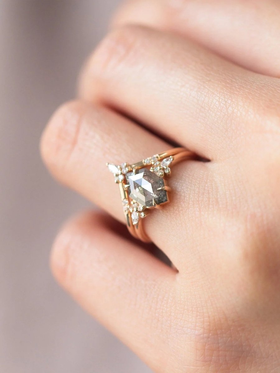 Gold ring with a diamond on a blurred background