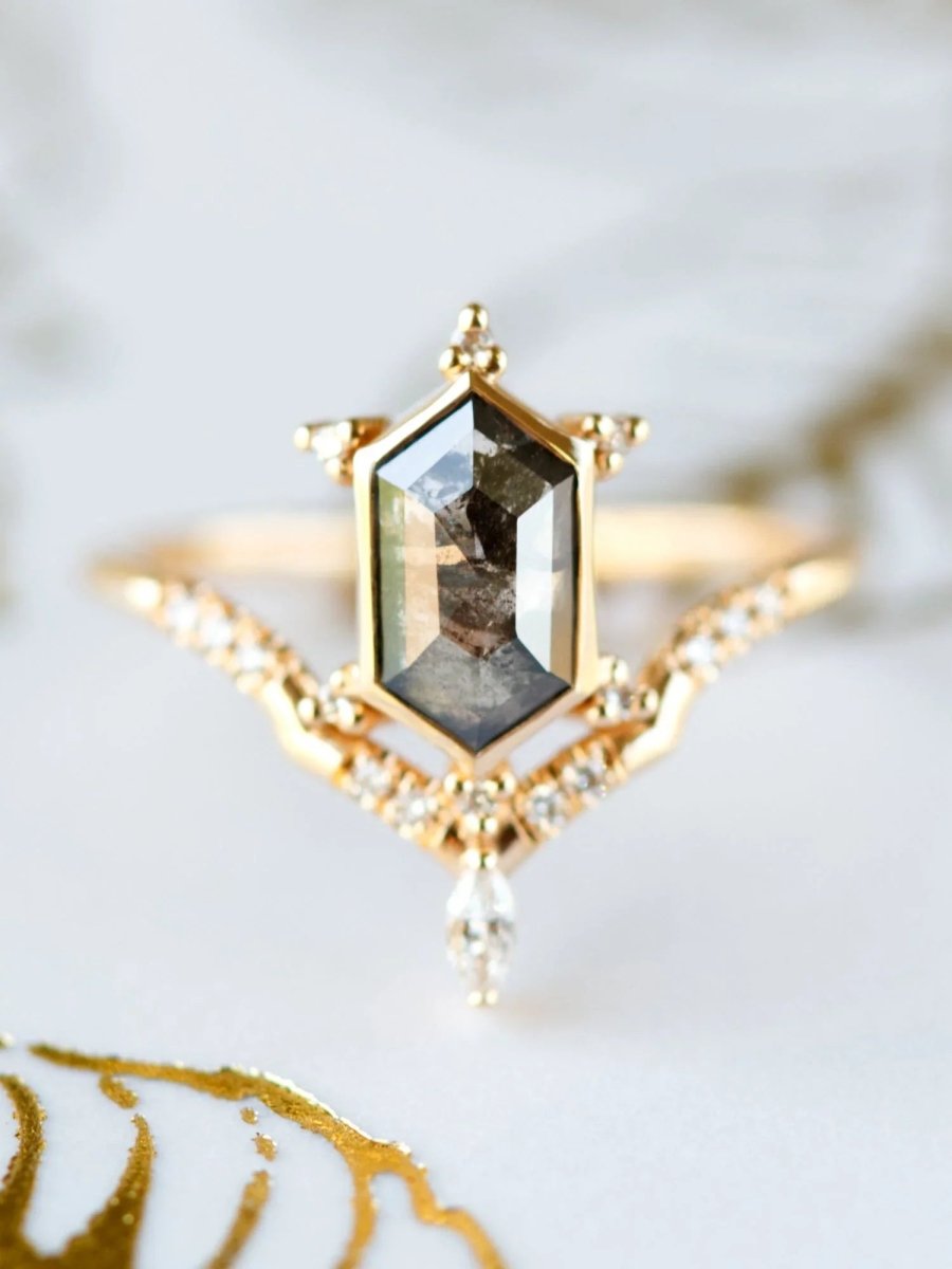 Unique art deco styled hexagon salt and pepper diamond engagement ring in 14k rose gold with a marquise and round diamonds.