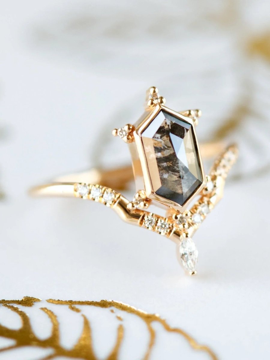 Unique art deco styled hexagon salt and pepper diamond engagement ring in 14k rose gold with a marquise and round diamonds.