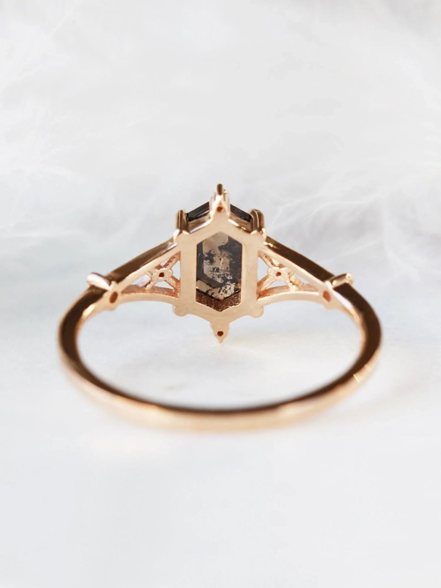 Hexagon salt and pepper diamond engagement ring in 14k rose gold with smaller and round diamonds inspired by the art deco style and minimalism.