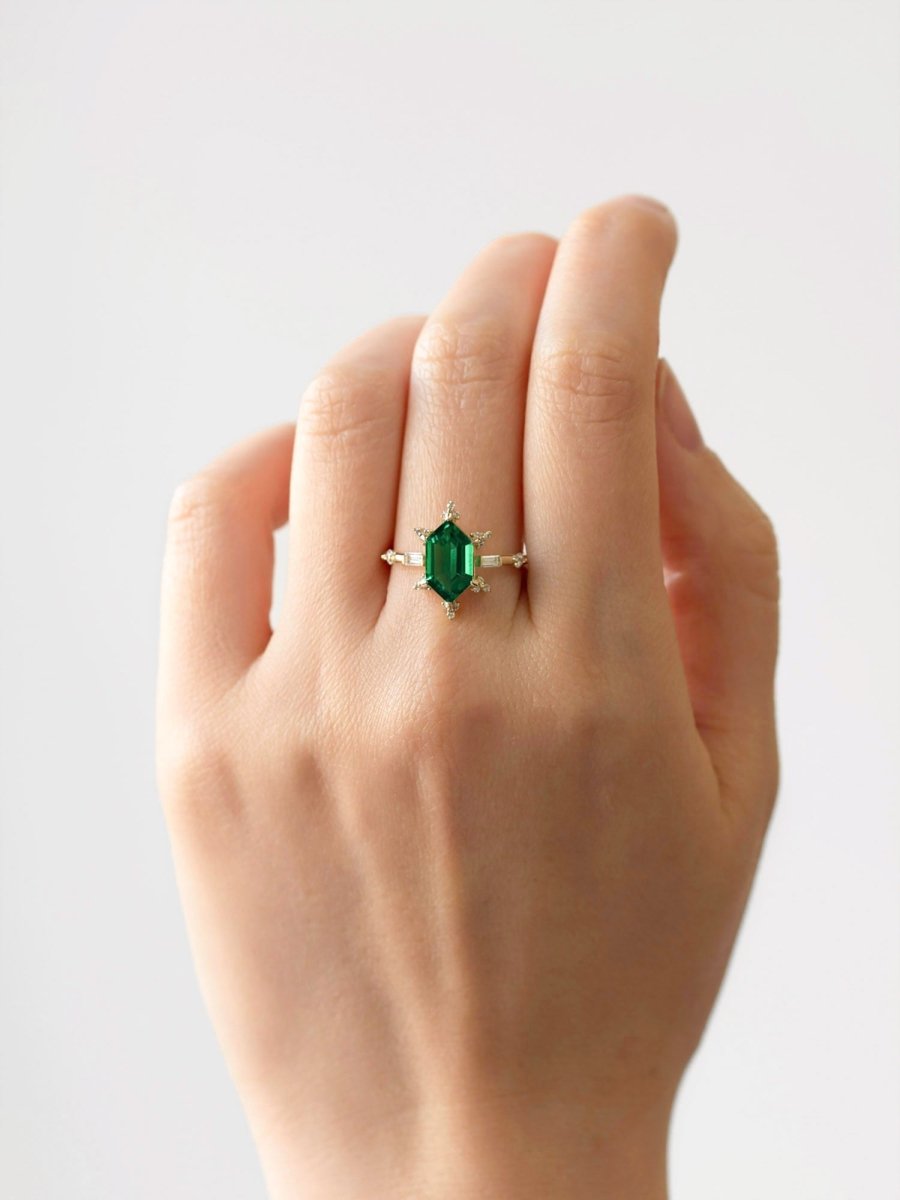 hiddenspace-jewelry-queen-of-ice-emerald-diamond-alternative-ring-14k-yellow-gold-hand-1