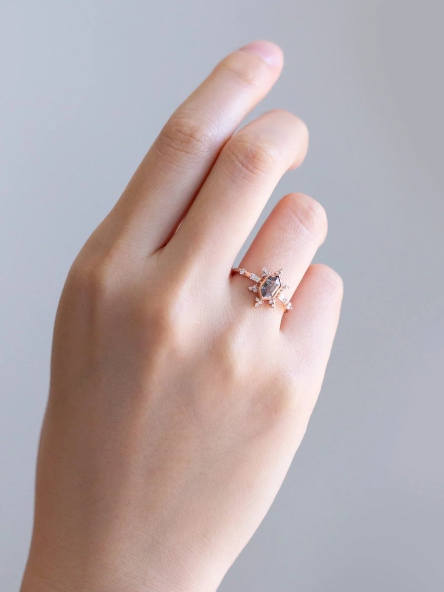 Relaxed hand wearing vintage-modern rose gold Art Deco ring on ring finger, showcasing its elegant design and timeless appeal