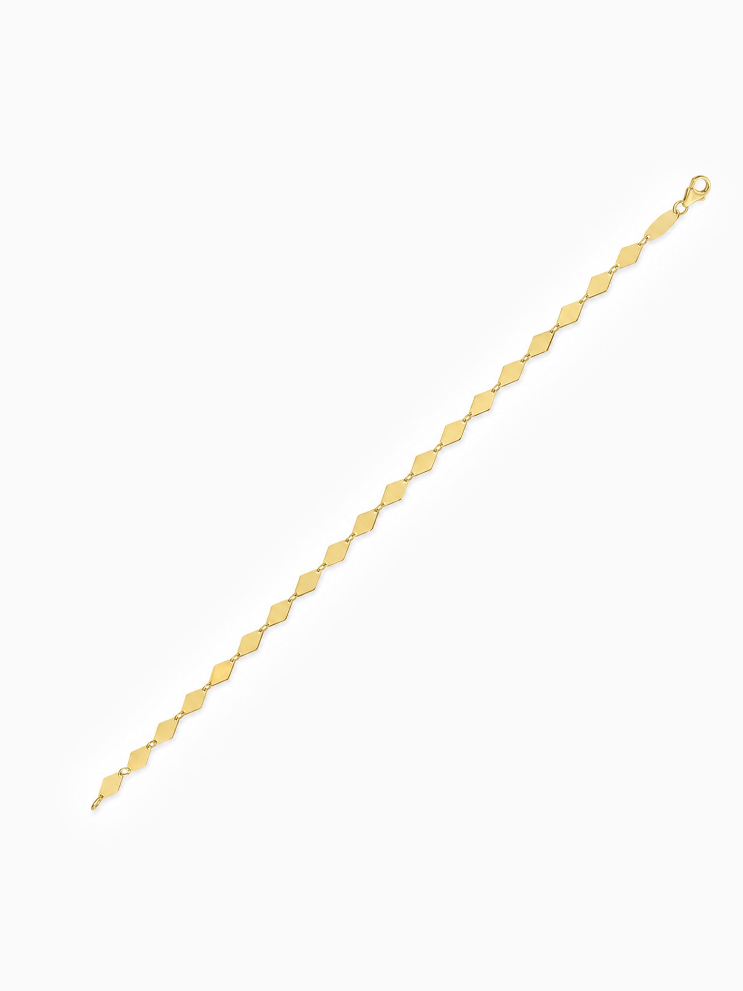 A delicate yellow gold chain bracelet with repeating flat Kite diamond-shaped links, shown diagonally on a plain white background.