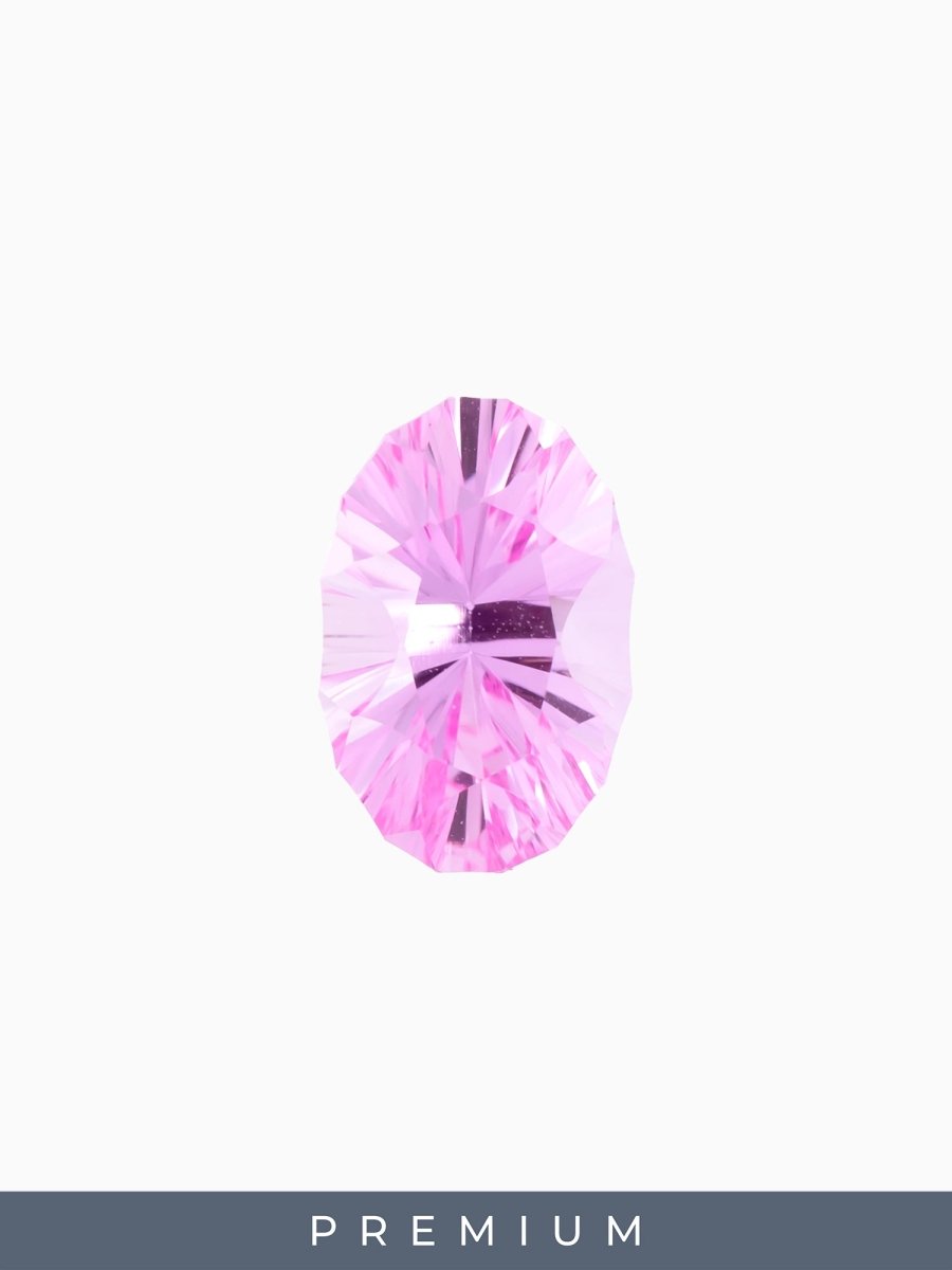 Pink gemstone with 'PREMIUM' label on a white background
