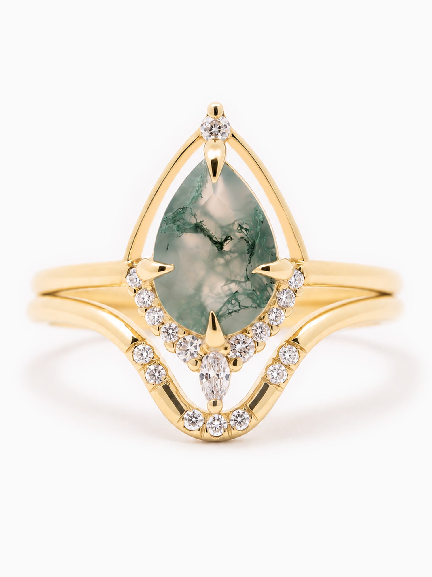Gold ring with a green gemstone and diamond accents on a white background