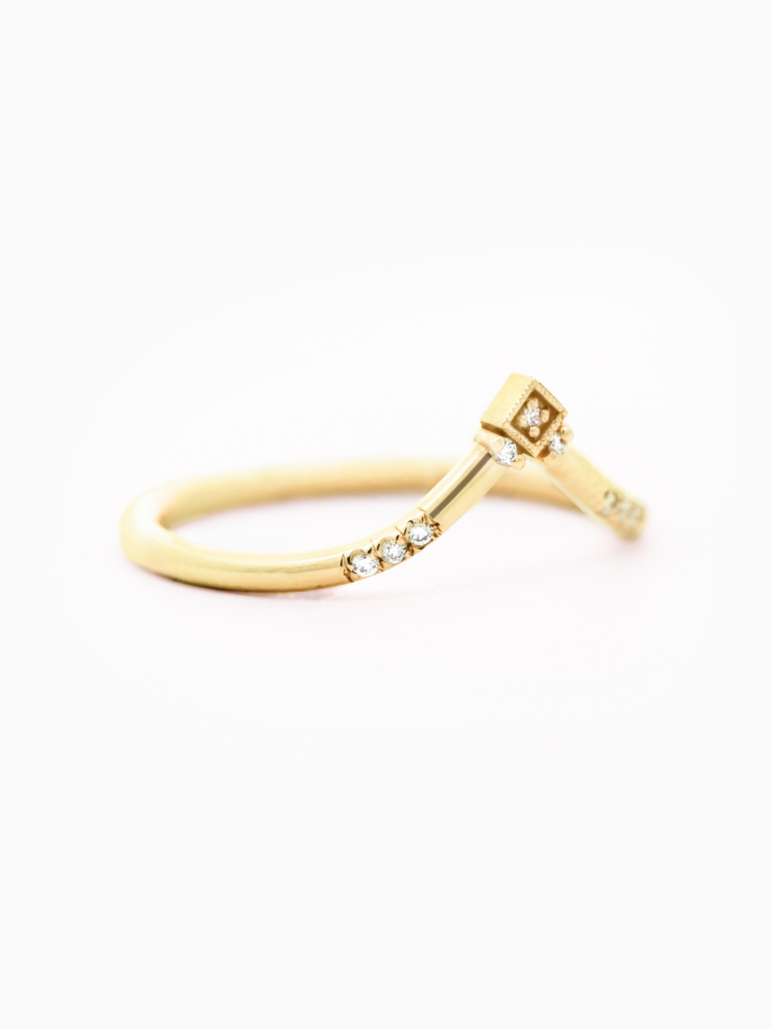 Modern geometric engagement band in 14k yellow gold with a symmetrical design in round diamond placements for a contemporary look.