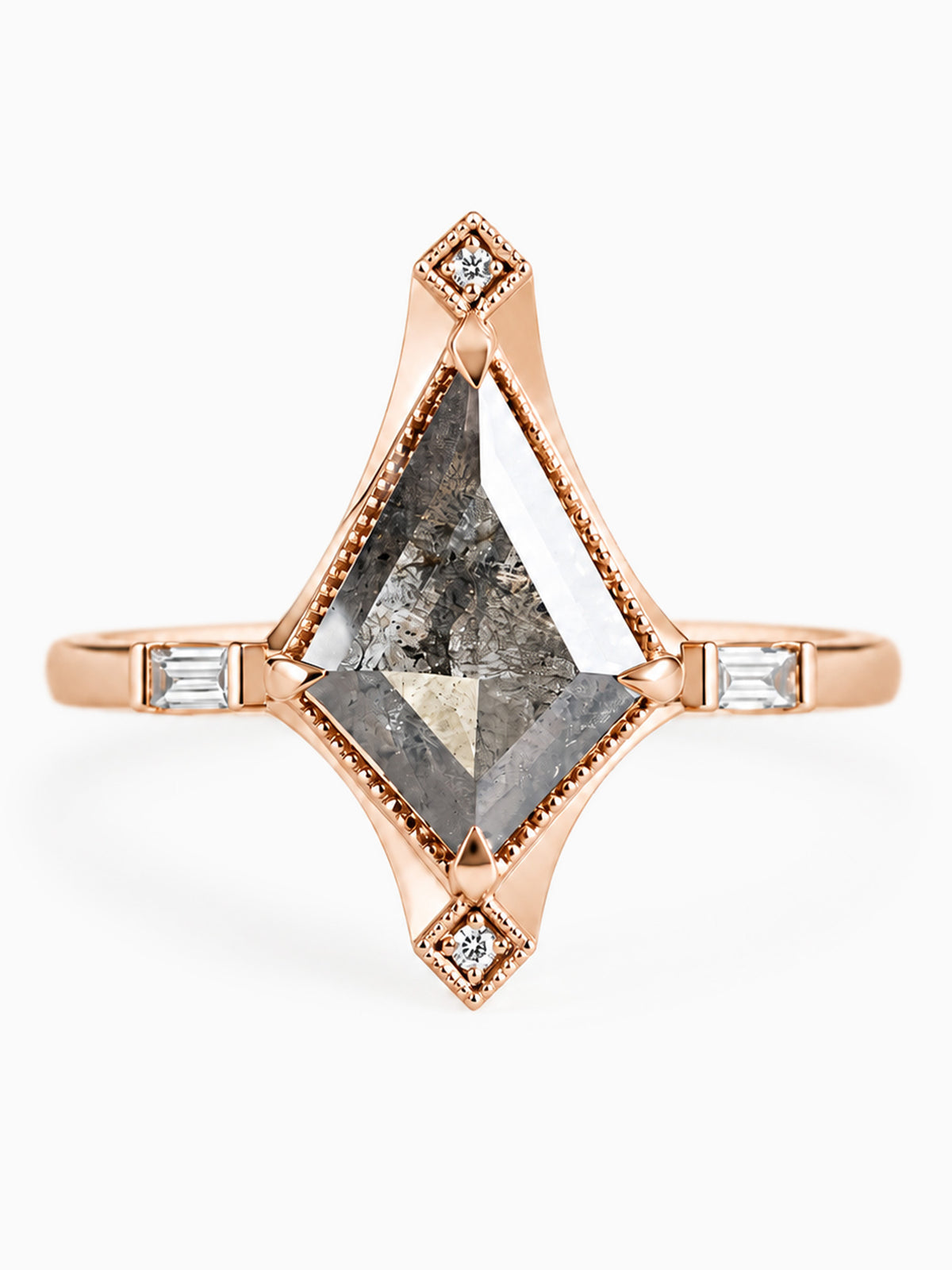 A rose gold ring featuring a large, faceted gray diamond-cut center stone, accented by small round diamonds and baguette-cut side stones on a clean white background.