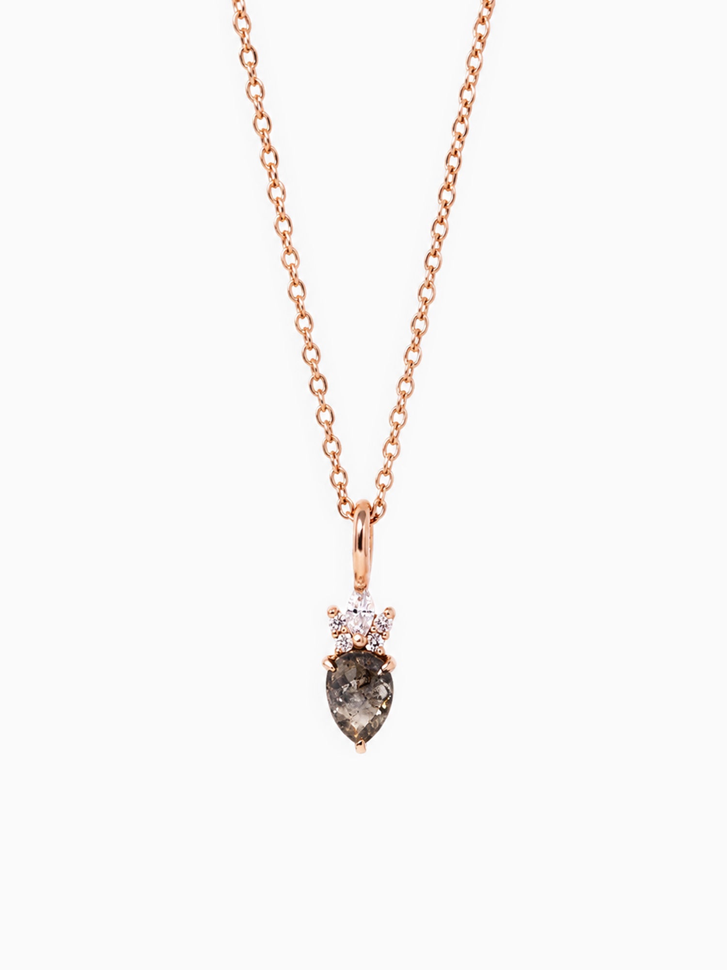 Rose gold necklace with a teardrop-shaped dark gemstone pendant on a white background