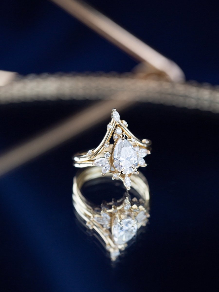 Gold ring with a diamond on a dark background