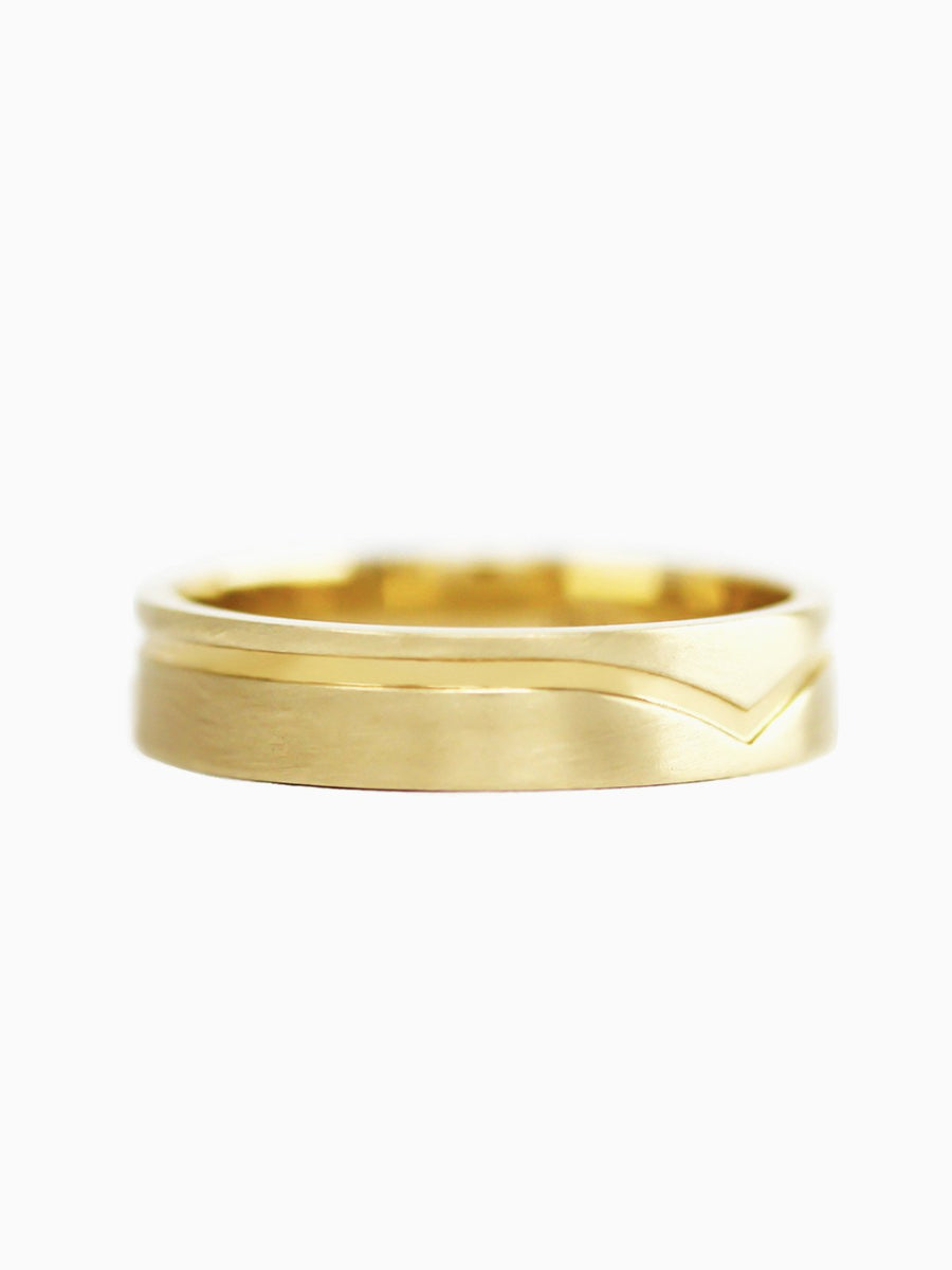 Gold ring on a white background