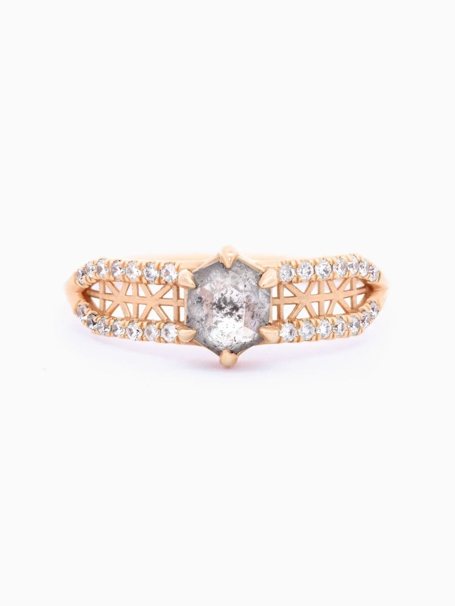 Face view of contemporary architectural engagement ring with split shank, lattice detail, pave melee diamonds, and claw-pronged hexagon salt pepper diamond