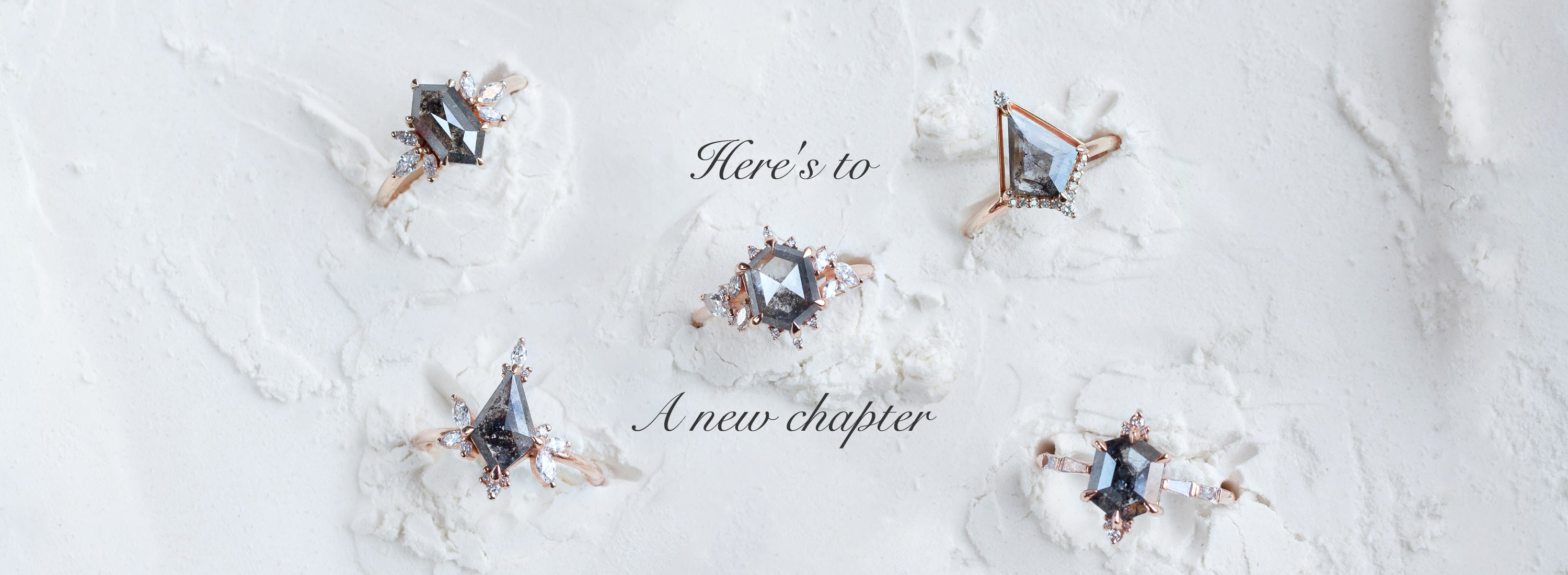 Diamond ring with gemstone on a textured white background