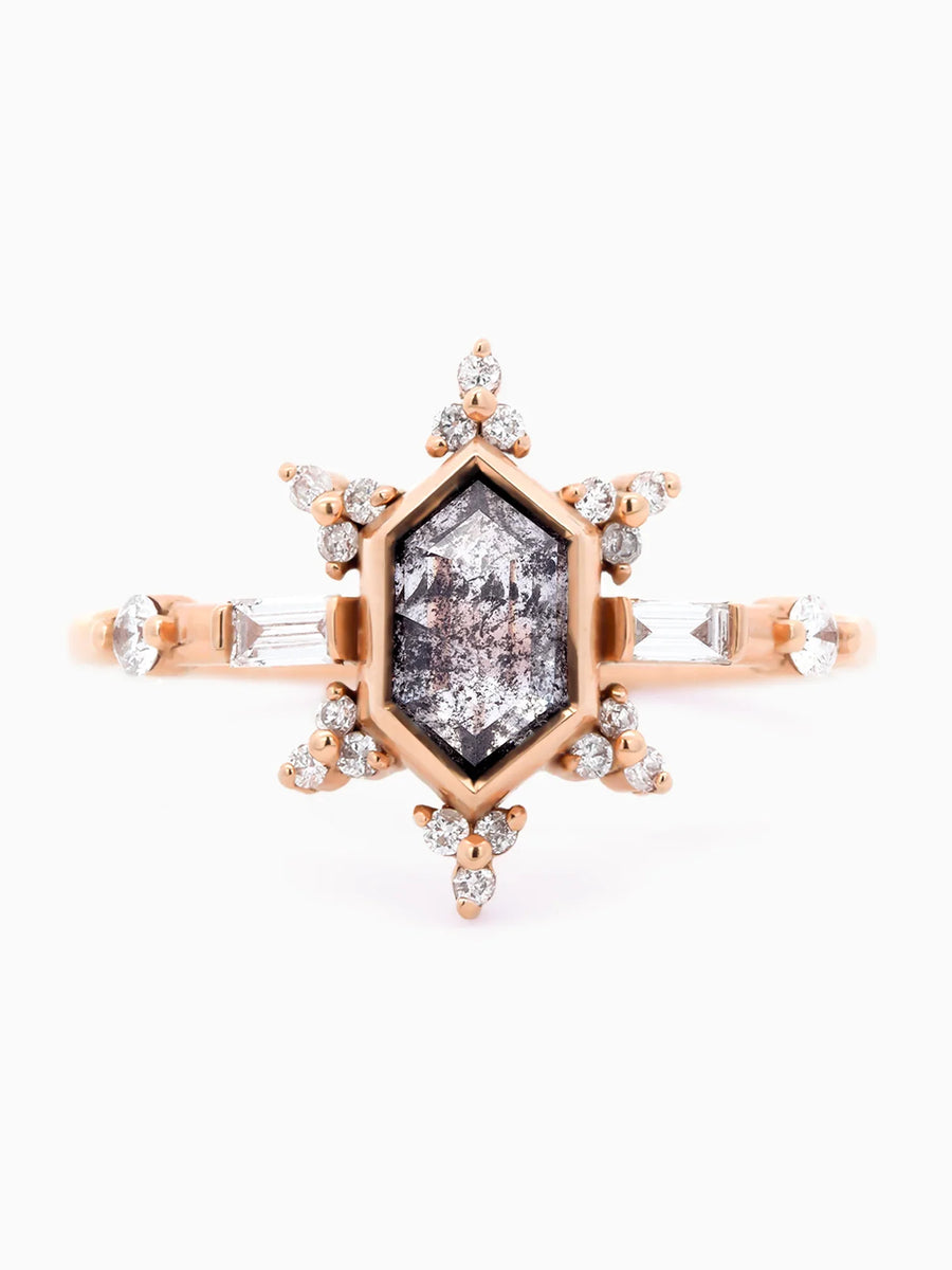 Face view of vintage-modern rose gold Art Deco ring with bezel-set salt and pepper hexagon, sunburst halo, and mixed side stones