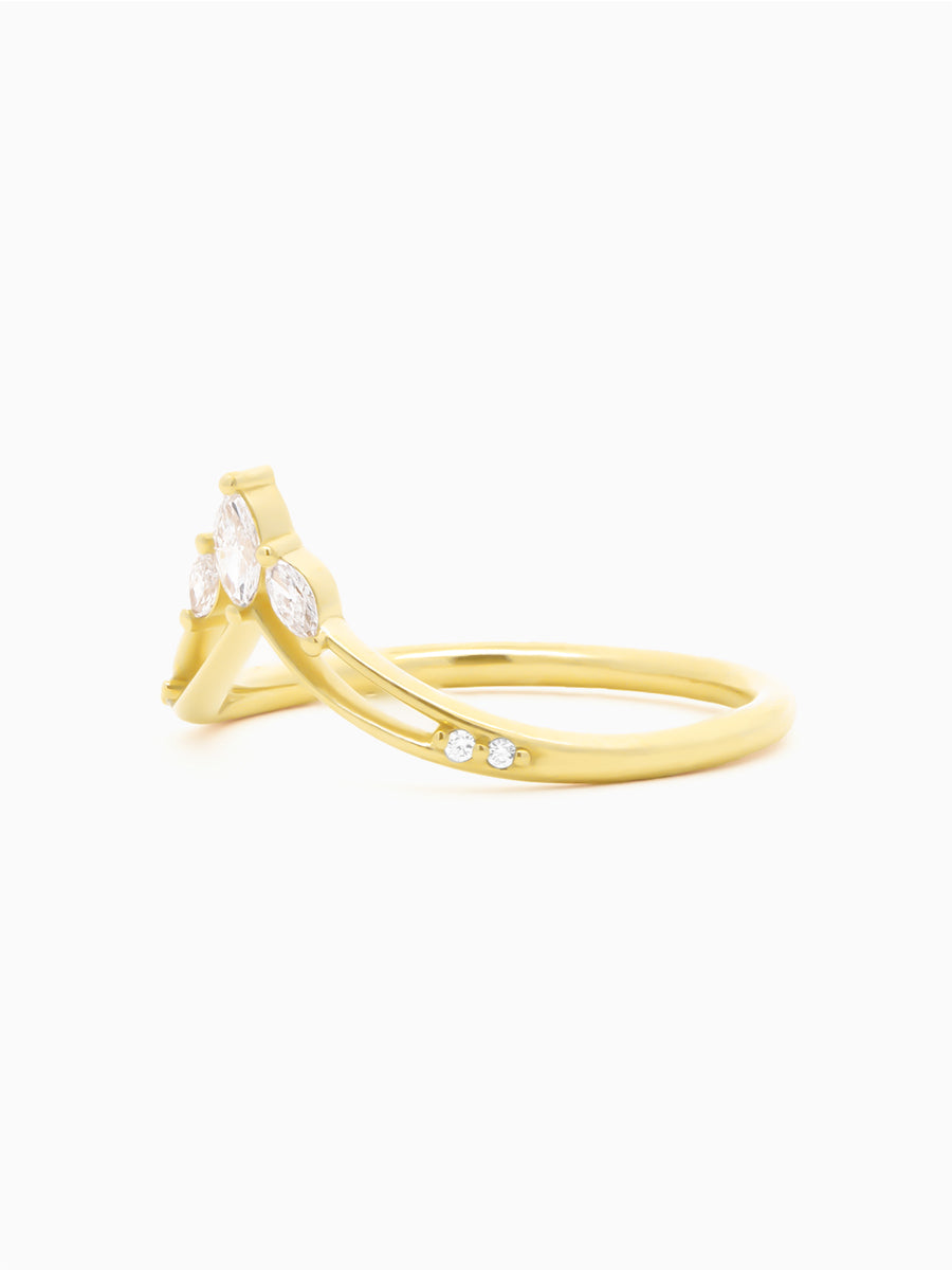 Gold ring with small diamonds on a white background