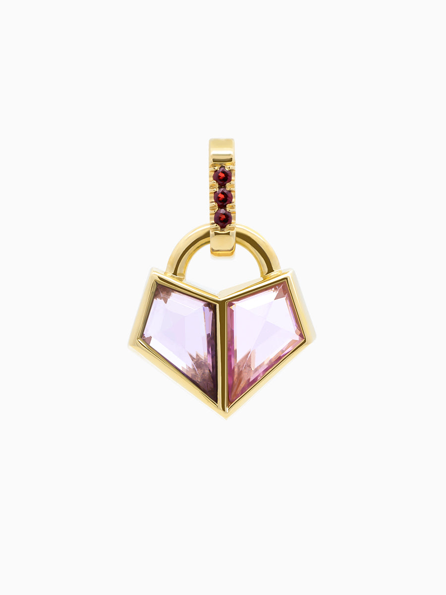 0.40 Total Carat Charm in yellow gold with two pink kite-cut spinels forming a heart and red garnet accents on white background.