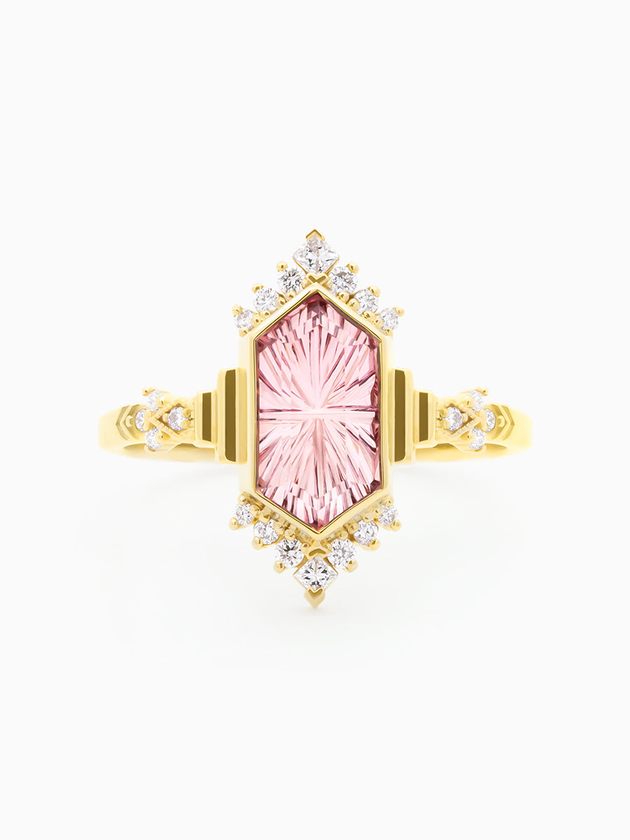 Gold neo-deco ring with a pink gemstone, semi-halo, and sculptural details on a white background. Front View