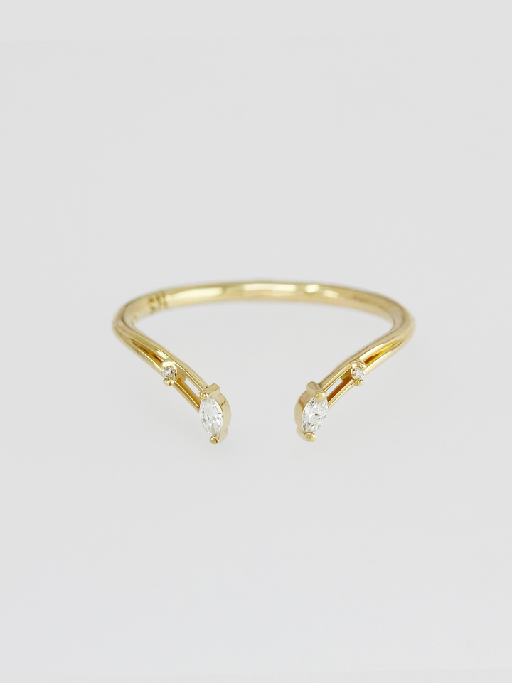 Modern open engagement band in 14k yellow gold with a symmetrical marquise diamond placement for a fresh enhancement to your perfect engagement ring. 