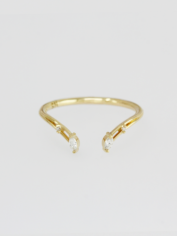 Modern open engagement band in 14k yellow gold with a symmetrical marquise diamond placement for a fresh enhancement to your perfect engagement ring. 