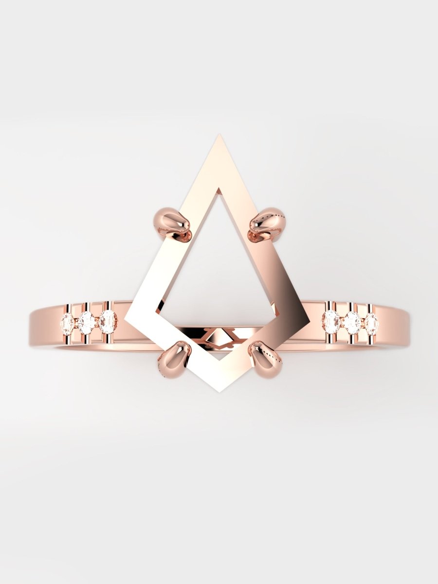 Rose gold bracelet with geometric design on a light gray background