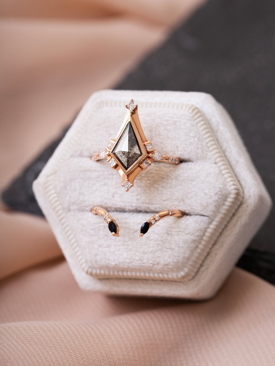 Rose gold ring with a diamond on a hexagonal jewelry box