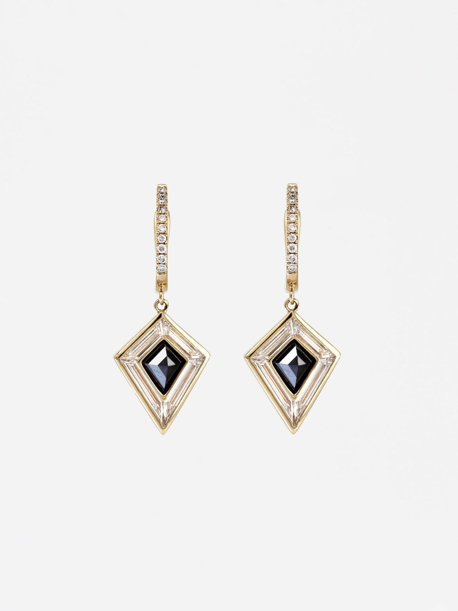 A pair of earrings featuring a black moissanite kite-shaped stone, surrounded by lab-grown baguette diamonds, with a U leverback earring style and natural white diamond pavé accents.